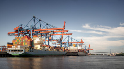 Container cargo freight ship and Terminal in the port of Hamburg