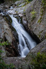 Fototapeta premium Few autumn leaves surround waterfall near Blue Ridge Parkway