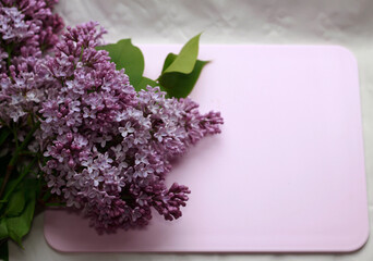 lilac flowers on wooden table