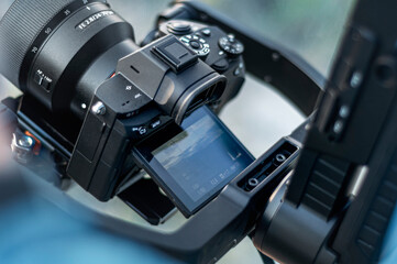 Fototapeta na wymiar Video Camera with stabilizer. Professional filming equipments