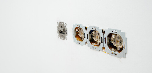 Paris, France - June 8, 2020: Row of multiple power sockets during installation renovation of whole electrical system in house with RJ45 internet cable - Busch-Jaeger Elektro GmbH made in Germany sign