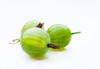 Three green gooseberrys isolated on white background. Close up view