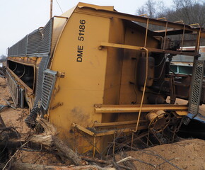 Fototapeta premium Train wreck with grain hopper car on its side