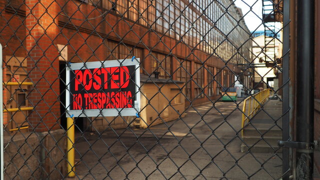trespassing sign at an abandoned steel mill