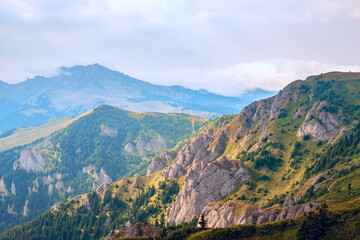 A beautiful mountain landscape with rocks, fir trees, mountain peaks