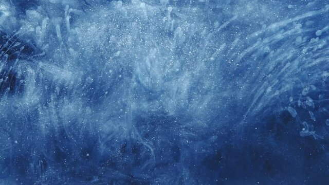 Paint water splash. Magic firework. Blue glitter fog flow abstract background.
