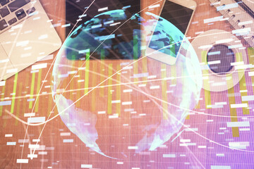 Double exposure of business theme hologram over desktop with phone. Top view. Mobile international trade connection concept.