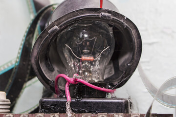 Old incandescent lamp made of transparent glass