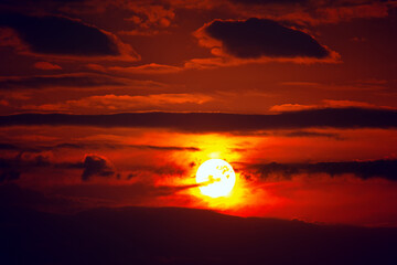 Mystical Sunset with Red Sky and Big Sundial . Dramatic Clouds at Red Heaven  © Leilani