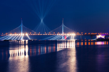 Fototapeta na wymiar festive illumination over the bridge on Scarlet Sails celebration in St. Petersburg, Russia, in June 2020