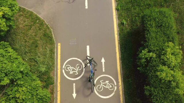 Bicycle on the roud on the background of Bicycle road sign and bike riders