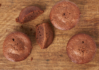 baked round brownie cakes on wooden background