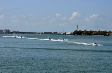 Jet skis leaving wake trails on Biscayne Bay