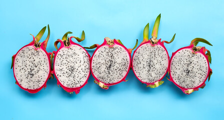 Ripe dragonfruit or pitahaya on blue background.