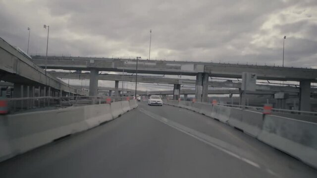 Montreal, QC, Canada - November 15, 2017: vehicles traffic view while driving on temporary interchange road during construction on the highway.