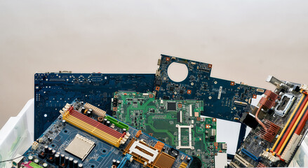 Colored heap of electronic, plastic and metal parts from old discarded or obsolete PC components....