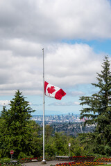 Canadian flag flying at half-mast.     Vancouver BC Canada
