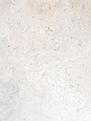 Pastel color wavy layout on solid sheet of wallpaper. Concept of home decor and interior designing.