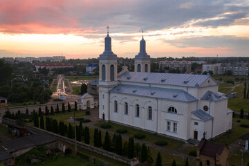 Fototapeta na wymiar Beautiful church in the style of late classicism in the city center at sunset in summer. aerial photography