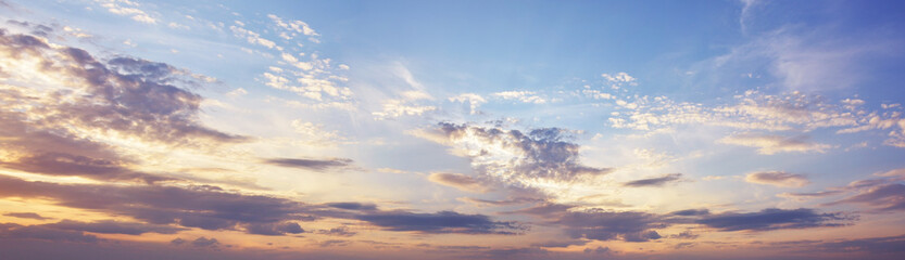 Sky at sunset with dark clouds, panoramic big shot. Background from the cloudy sky