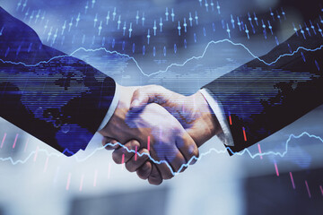 Double exposure of forex graph hologram and handshake of two men. Stock market concept.