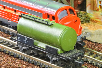 Railway tanker truck. Train hobby model on the model railway. Close-up