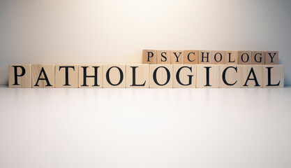Pathological psychology text from wooden cubes. The term psychology profession.