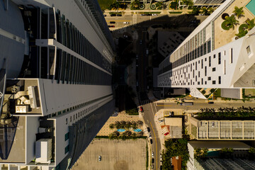 Aerial photo building shadow looming over a city street