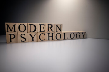 Modern psychology text from wooden cubes. The term psychology profession.