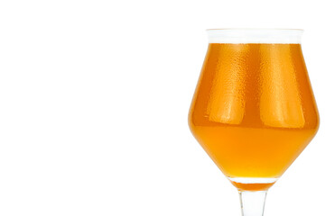 Cold beer in a Teku tasting glass filled to full with foam, drops of water on glass, the glass is on the right, isolated on a white background with a clipping path.