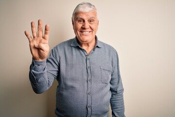 Senior handsome hoary man wearing casual shirt standing over isolated white background showing and pointing up with fingers number four while smiling confident and happy.