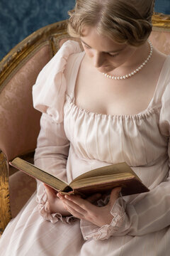 A Young Regency Period Woman In A Pale Pink Gown