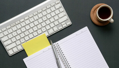 Top view of office desk with cup of coffee