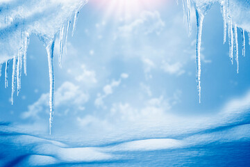 Obraz na płótnie Canvas White icicles against the blue winter sky.