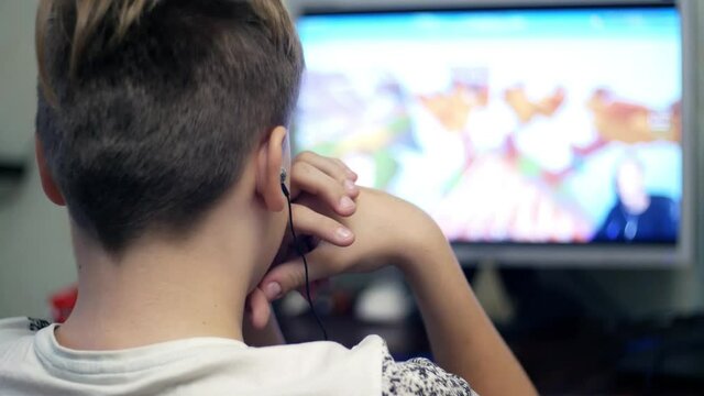 Teen guy boy child watching video game reviews on video hosting