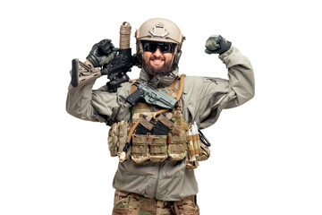 USA soldier in a military suit with a rifle smiles and shows strength on a white background, America commando in uniform with a weapon