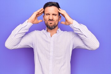 Young handsome man wearing casual striped shirt standing over isolated purple background with hand on head, headache because stress. Suffering migraine.