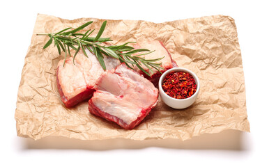 Raw beef short ribs with spices on white background