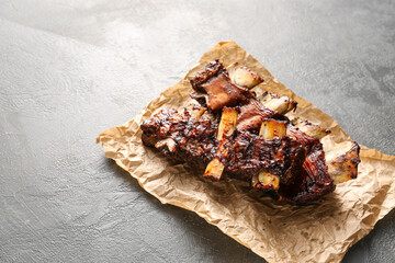 Tasty beef short ribs on dark background