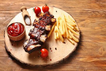 Tasty beef short ribs with sauce and french fries on table