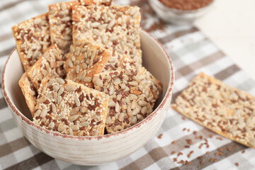Bowl with cereal cookies on table