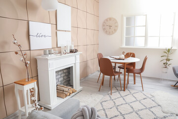 Stylish fireplace with table in interior of living room