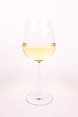 Glass of white wine on white background isolated