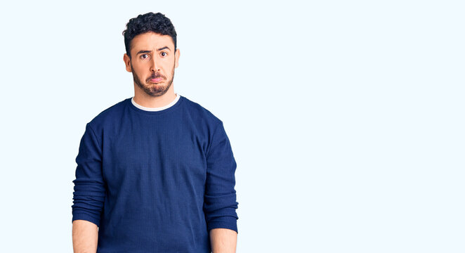 Young hispanic man wearing casual clothes depressed and worry for distress, crying angry and afraid. sad expression.