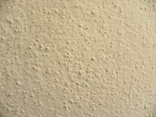 Yellow concrete wall textured background