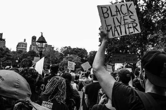 Man holds up Black Lives Matter sign