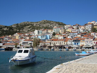 Fototapeta na wymiar View of the port of Pythagoreio on the Greek island of Samos with a docked boat and buildings in the background