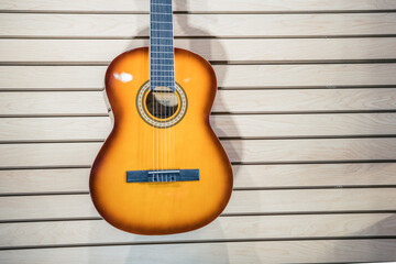 Fototapeta na wymiar guitar shop with guitar in the wall