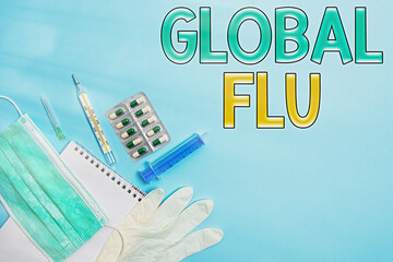 Writing note showing Global Flu. Business concept for Common communicable illness spreading over the worldwide fastly Set of medical equipment with notepad for health condition assessment