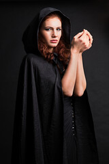 portrait of a young woman in a black coat